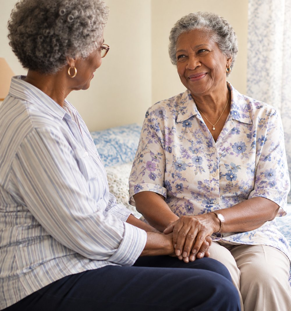 Two friends talking together in a sunlit room